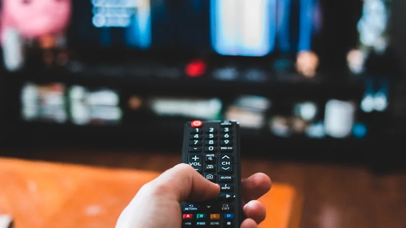 Split image concept comparing a traditional cable remote with a modern streaming device